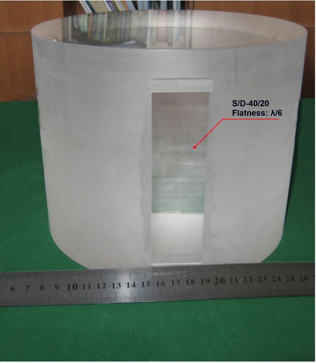 Large polished optical cylinder with a precision window