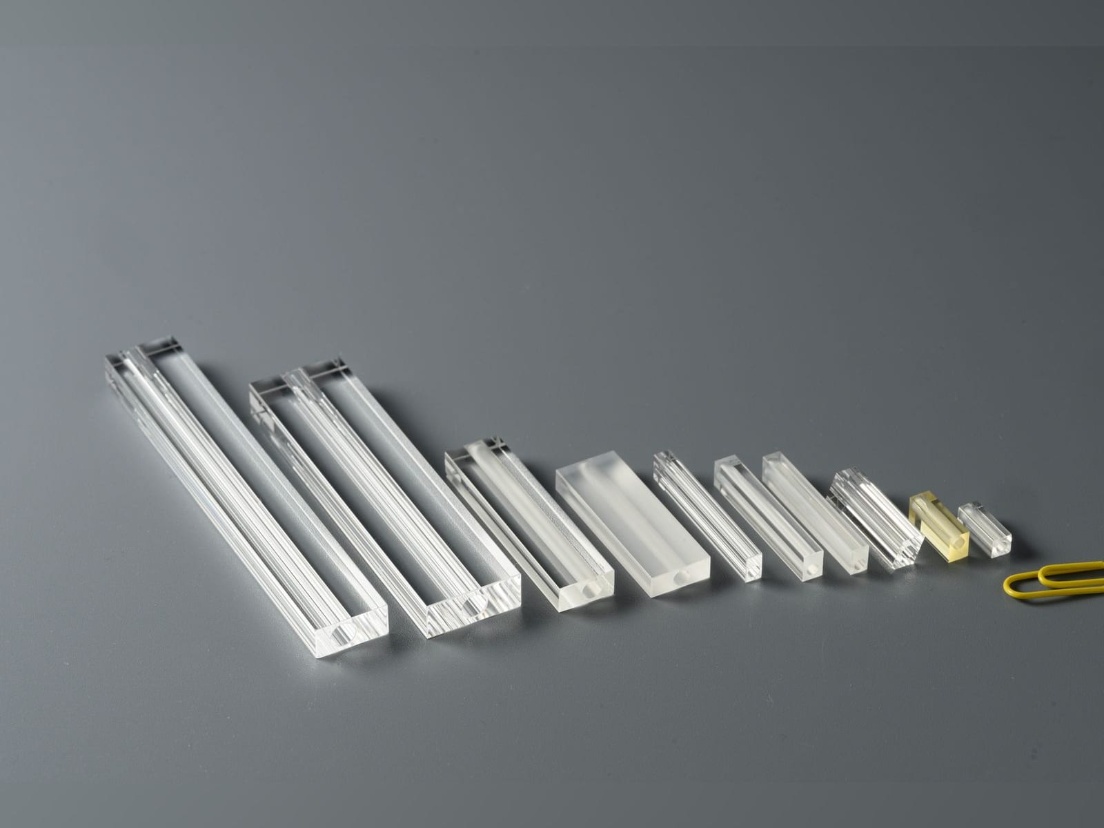 Rectangular flow tubes of different sizes next to a paper clip