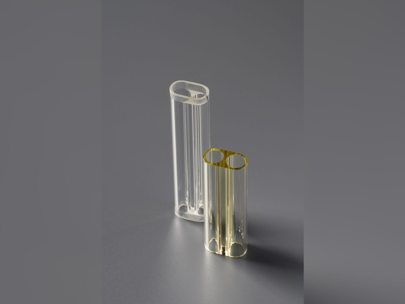 Clear and yellow oval two-hole flow tubes