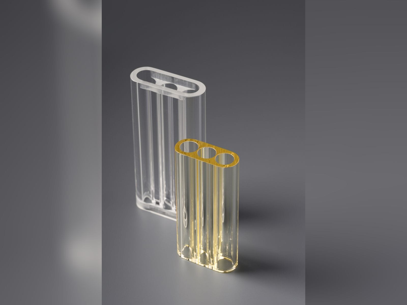 Clear and yellow oval three-hole flow tubes