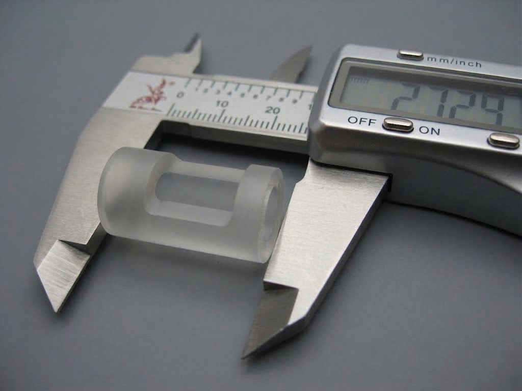 Small frosted tube with a window measured with a digital caliper