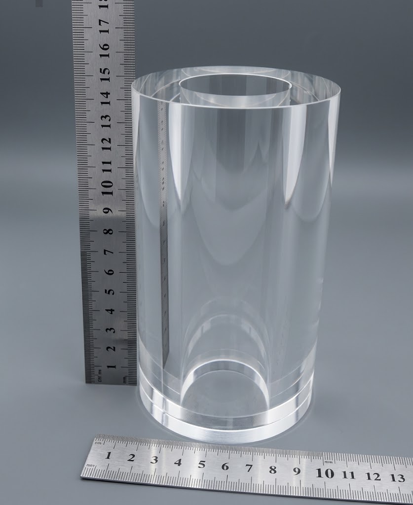 Thick-wall polished tube next to rulers
