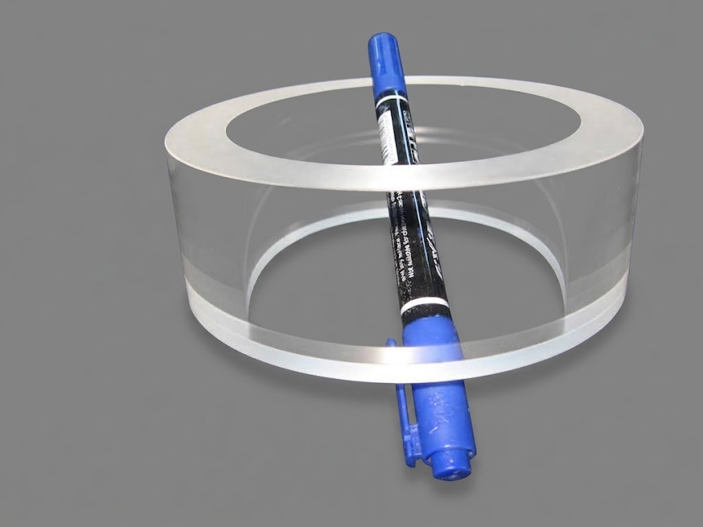 Wide polished ring with a marker pen inside