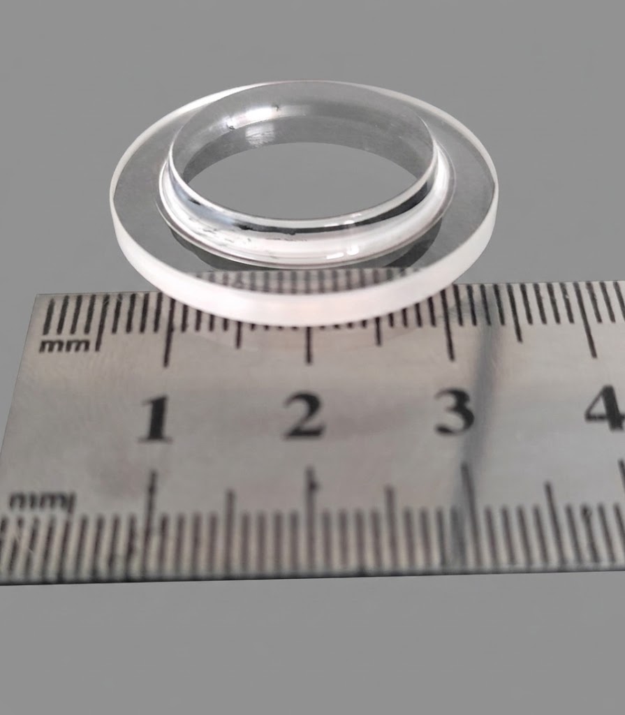Stepped window ring measured against a ruler